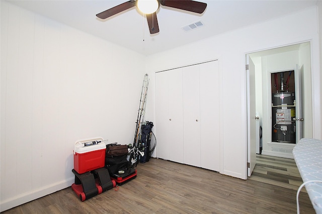 710 Longbeach Dr, Garland, TX 75043 - interior space with gas water heater, a ceiling fan, wood finished floors, and visible vents