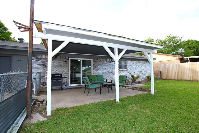710 Longbeach Dr, Garland, TX 75043 - exterior space featuring a lawn, fence, a patio area, and brick siding