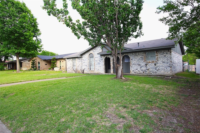 710 Longbeach Dr, Garland, TX 75043 - single story home with brick siding and a front yard