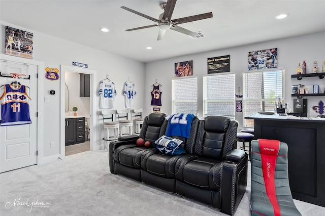home theater with light carpet, a ceiling fan, visible vents, and recessed lighting