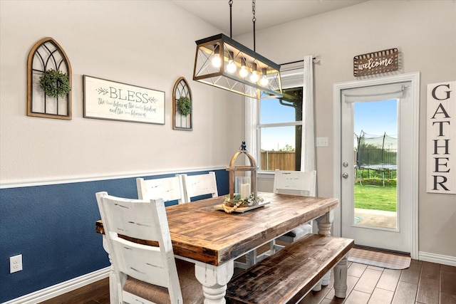 3912 Burks Ct, Celina, TX 75009 - dining space featuring a chandelier, wood finished floors, and baseboards