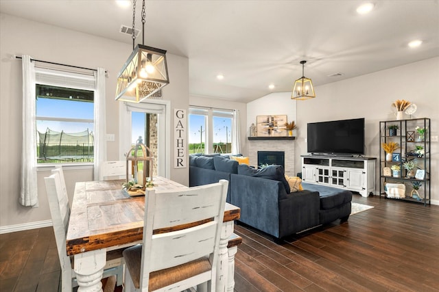 3912 Burks Ct, Celina, TX 75009 - dining space featuring dark wood-style floors, a glass covered fireplace, baseboards, and recessed lighting