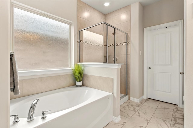 3912 Burks Ct, Celina, TX 75009 - full bath featuring marble finish floors, a garden tub, a stall shower, recessed lighting, and baseboards