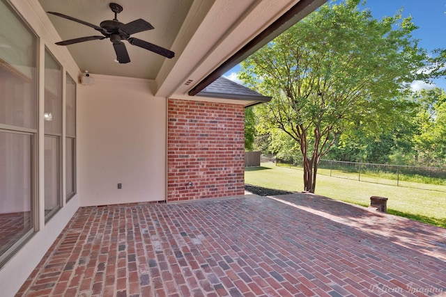 view of patio with fence and ceiling fan