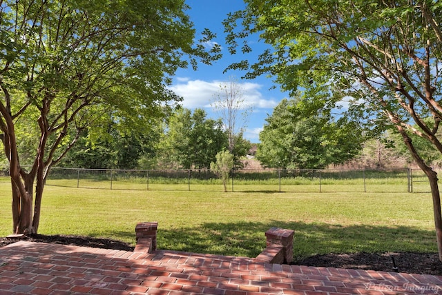 view of yard featuring a patio area and fence