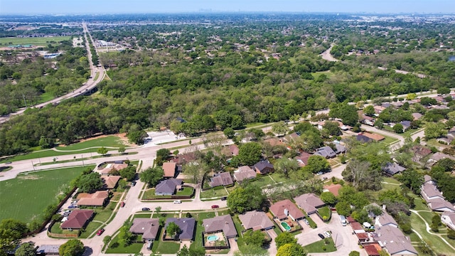 birds eye view of property with a residential view