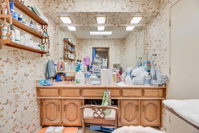 bathroom with wallpapered walls