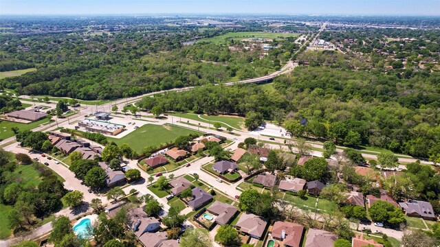 birds eye view of property with a residential view and a forest view