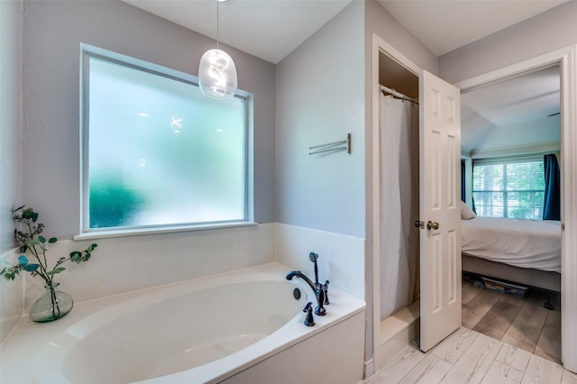 300 Dove Crk, Mckinney, TX 75071 - ensuite bathroom with ensuite bathroom, a bath, and a shower with curtain