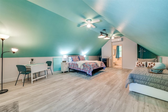 300 Dove Crk, Mckinney, TX 75071 - bedroom with wood finished floors, baseboards, a wall mounted AC, ensuite bath, and vaulted ceiling