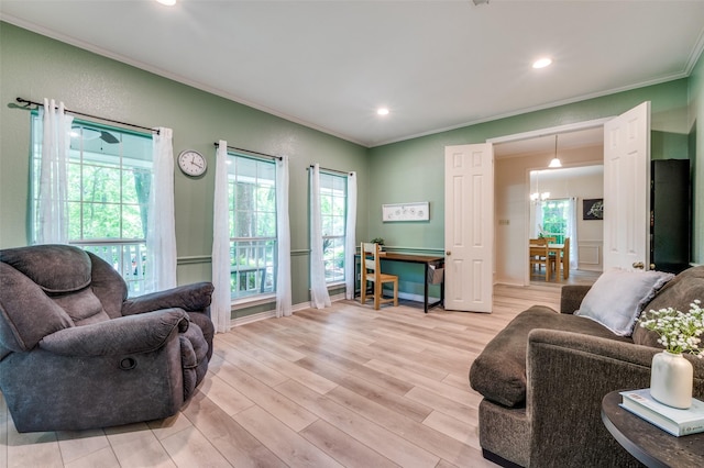 300 Dove Crk, Mckinney, TX 75071 - living area with crown molding, light wood-style floors, recessed lighting, and a notable chandelier