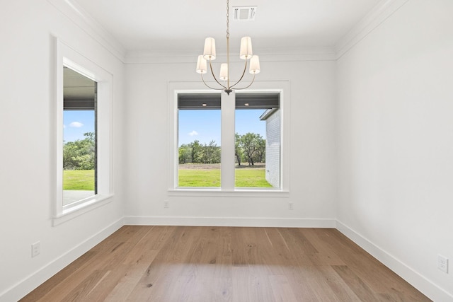 737 Burr Oak Ln, Weatherford, TX 76085 - unfurnished dining area featuring wood finished floors, a chandelier, baseboards, ornamental molding, and visible vents