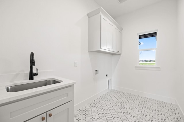 737 Burr Oak Ln, Weatherford, TX 76085 - clothes washing area featuring hookup for an electric dryer, cabinet space, a sink, and baseboards