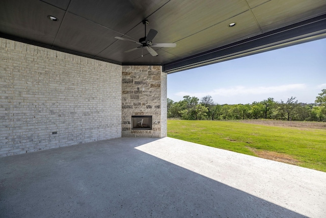 737 Burr Oak Ln, Weatherford, TX 76085 - view of patio with ceiling fan and an outdoor stone fireplace
