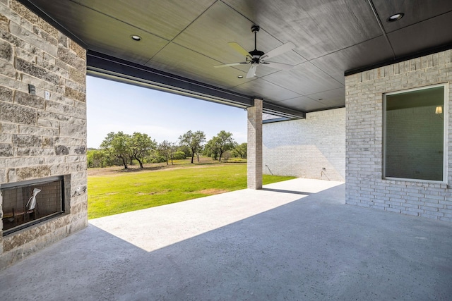 737 Burr Oak Ln, Weatherford, TX 76085 - view of patio / terrace with an outdoor stone fireplace and ceiling fan