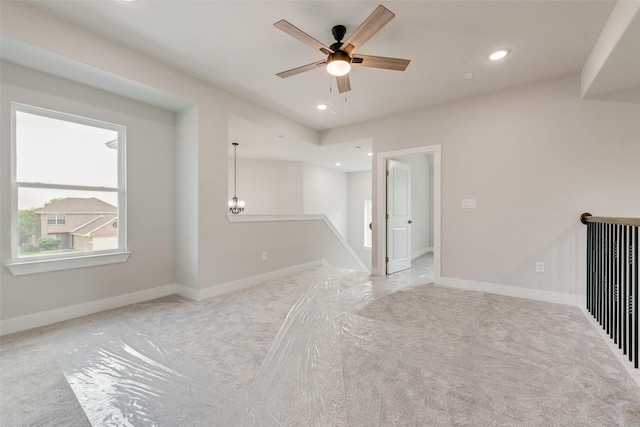empty room featuring recessed lighting, carpet flooring, baseboards, and ceiling fan