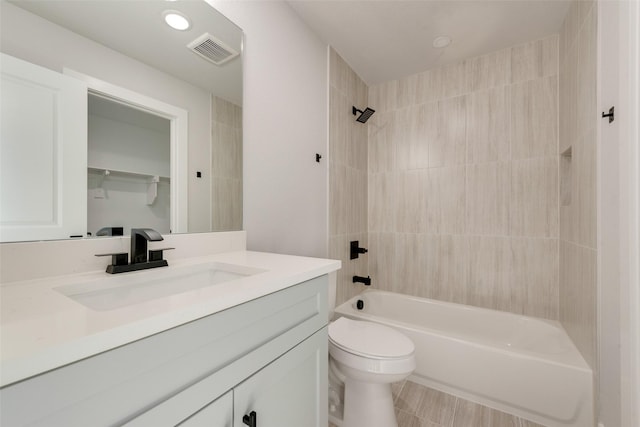 full bathroom with visible vents, vanity, toilet, washtub / shower combination, and recessed lighting
