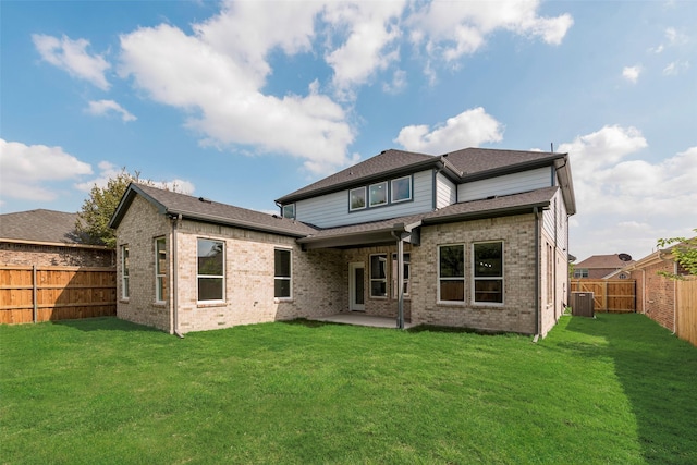 6810 Windward View Dr, Rowlett, TX 75088 - back of house with a patio area, central AC, and brick siding