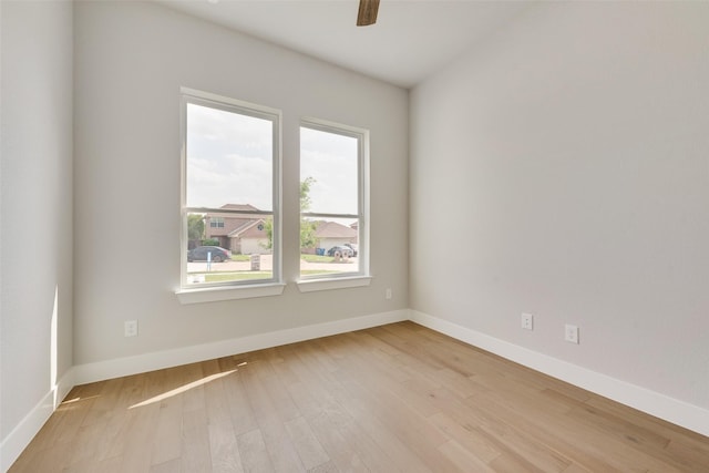 6810 Windward View Dr, Rowlett, TX 75088 - empty room with light wood finished floors, ceiling fan, and baseboards