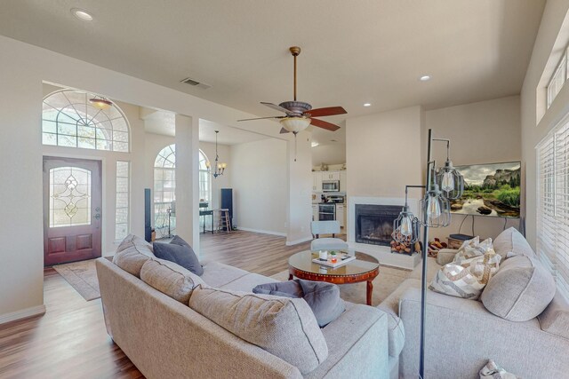 231 Dove Hill Ln, Weatherford, TX 76088 - living area with light wood-style flooring, visible vents, and a healthy amount of sunlight