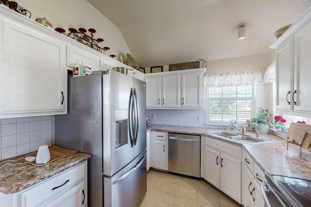 231 Dove Hill Ln, Weatherford, TX 76088 - kitchen with white cabinets, a sink, appliances with stainless steel finishes, and tasteful backsplash