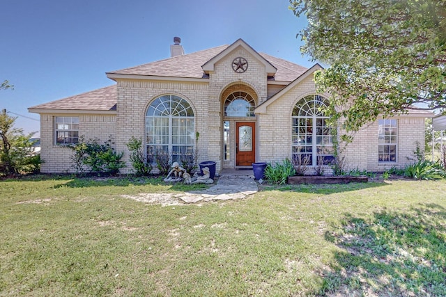 231 Dove Hill Ln, Weatherford, TX 76088 - french country style house featuring brick siding, roof with shingles, and a front yard