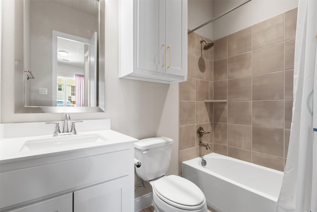 bathroom featuring toilet, vanity, and shower / bath combo with shower curtain