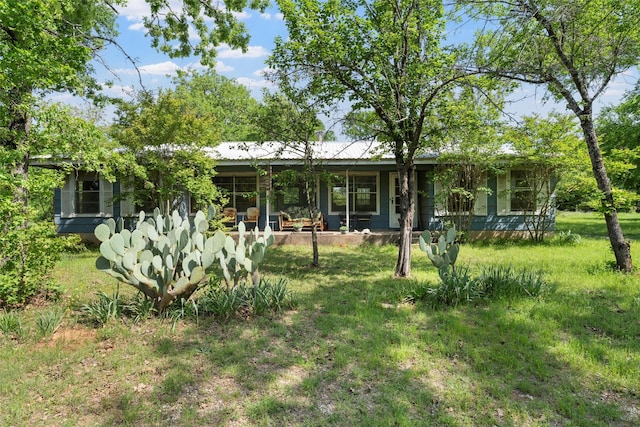 back of property with a lawn