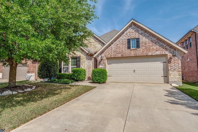 5220 Grove Cove Dr, Mckinney, TX 75071 - traditional home featuring stone siding, driveway, brick siding, and a garage