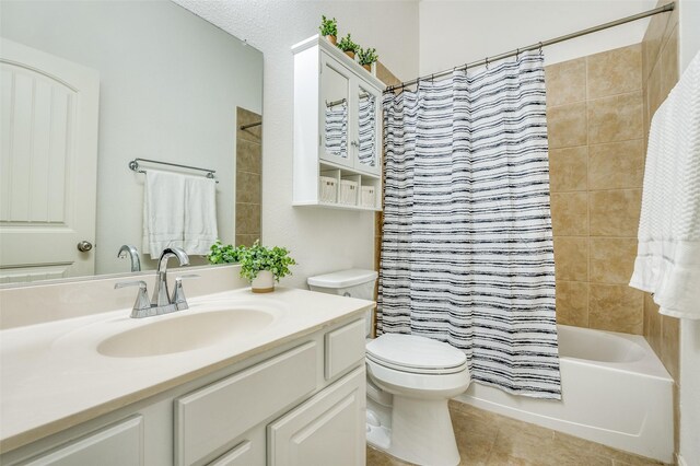 5220 Grove Cove Dr, Mckinney, TX 75071 - bathroom featuring vanity, shower / bath combination with curtain, toilet, and tile patterned flooring