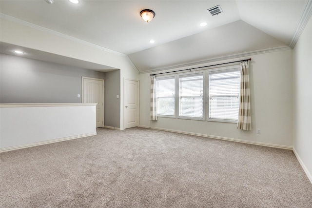 5220 Grove Cove Dr, Mckinney, TX 75071 - spare room featuring baseboards, light colored carpet, lofted ceiling, ornamental molding, and visible vents