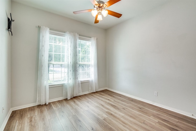 5220 Grove Cove Dr, Mckinney, TX 75071 - spare room with wood finished floors, baseboards, and ceiling fan