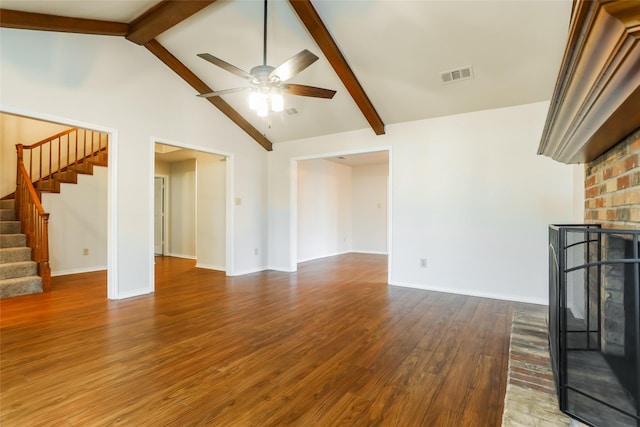 1 Roaring Creek Ct, Trophy Club, TX 76262 - unfurnished living room featuring stairway, wood finished floors, ceiling fan, a brick fireplace, and visible vents