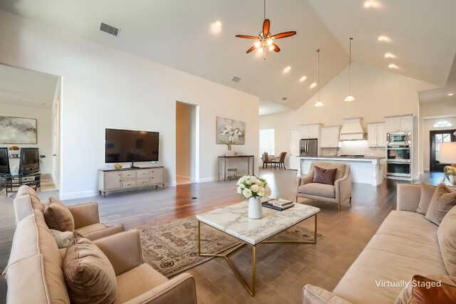 996 Heather Falls Dr, Rockwall, TX 75087 - living room with high vaulted ceiling, a ceiling fan, dark wood-style floors, and recessed lighting