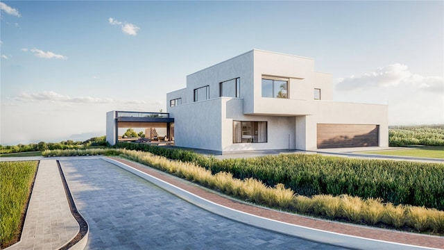 view of side of property featuring a garage and stucco siding
