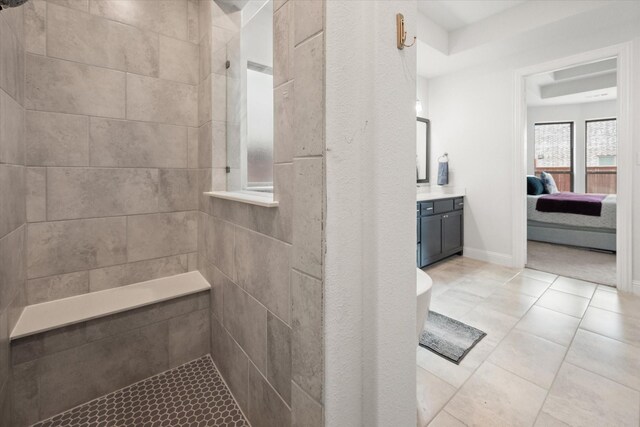 9300 Pecan Woods Trl, Argyle, TX 76226 - bathroom with tiled shower, vanity, ensuite bathroom, and tile patterned floors
