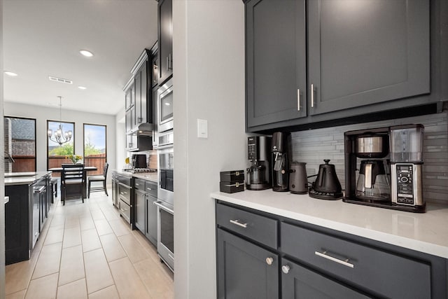 9300 Pecan Woods Trl, Argyle, TX 76226 - kitchen featuring decorative backsplash, light countertops, recessed lighting, decorative light fixtures, and a chandelier