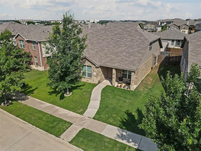 3412 San Lucas Ln, Denton, TX 76208 - view of front facade featuring a residential view, stone siding, and a front yard