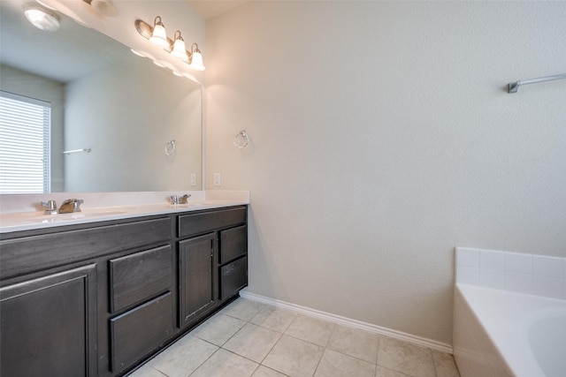 3412 San Lucas Ln, Denton, TX 76208 - full bathroom with double vanity, a garden tub, baseboards, and tile patterned flooring