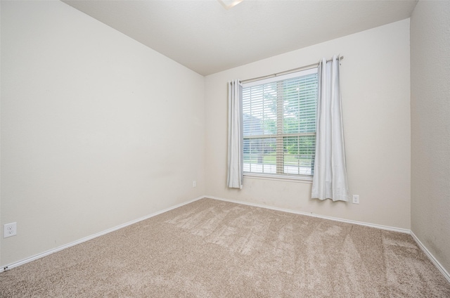 3412 San Lucas Ln, Denton, TX 76208 - empty room featuring carpet flooring, vaulted ceiling, and baseboards