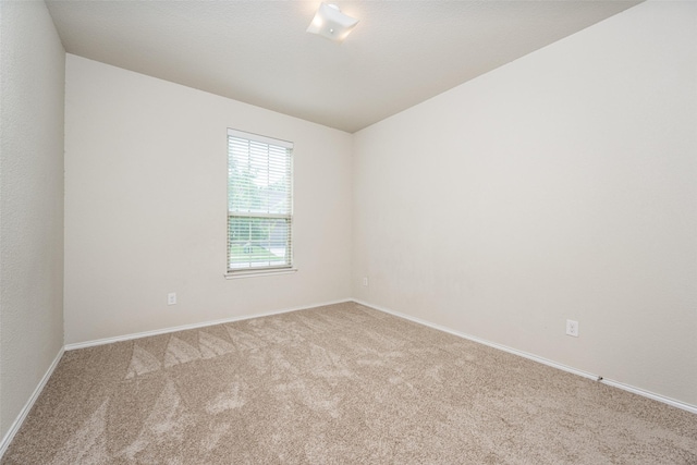 3412 San Lucas Ln, Denton, TX 76208 - empty room featuring carpet, baseboards, and lofted ceiling