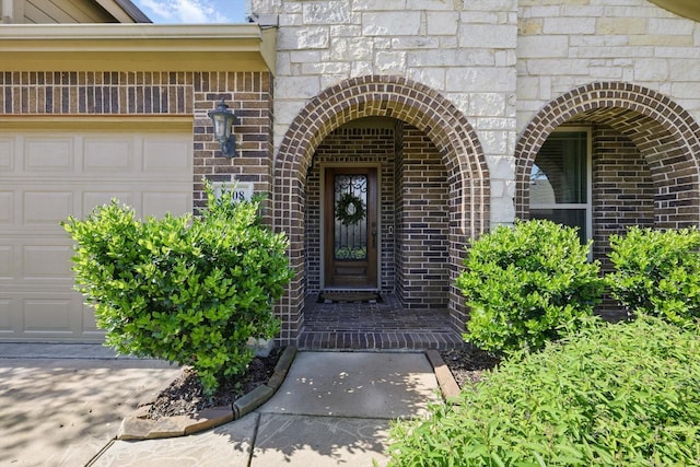 1308 Kittyhawk Dr, Little Elm, TX 75068 - property entrance featuring an attached garage and brick siding