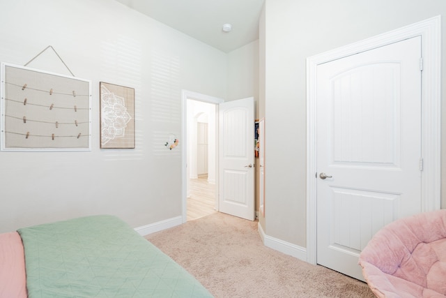 carpeted bedroom with baseboards