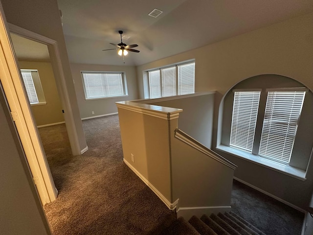 1217 Timber Grove Ter, Little Elm, TX 76227 - hallway with baseboards, dark colored carpet, and visible vents