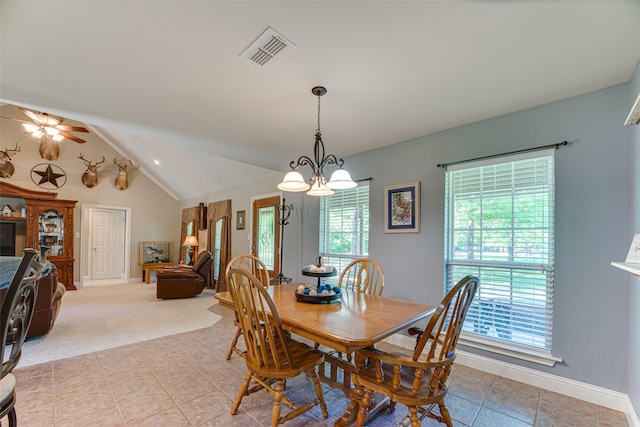 dining area featuring light tile patterned floors, baseboards, lofted ceiling, and visible vents