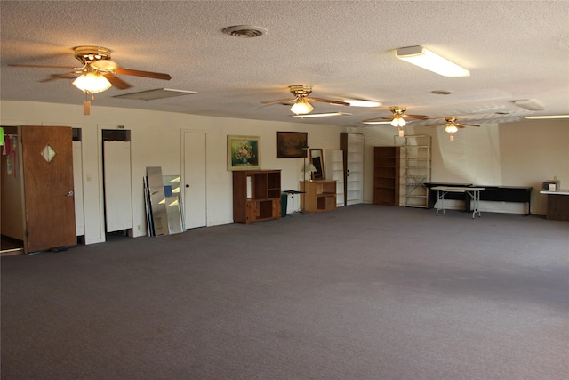 611 E 8th St, Cisco, TX 76437 - misc room with visible vents, carpet flooring, a textured ceiling, and ceiling fan