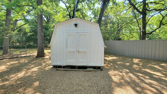 view of shed with a fenced backyard