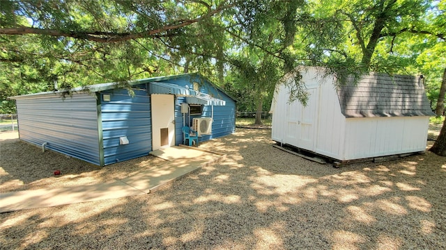 view of shed with fence