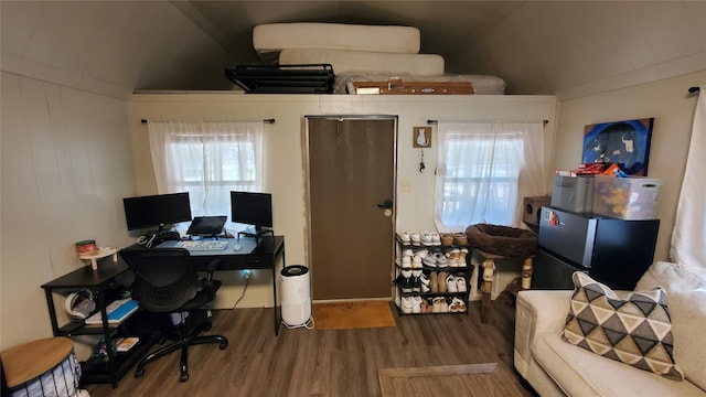 office featuring lofted ceiling and wood finished floors