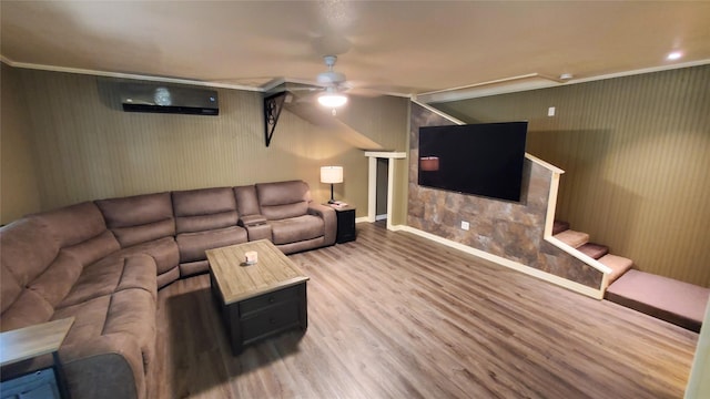 living room featuring baseboards, wood finished floors, stairs, ceiling fan, and a wall mounted AC